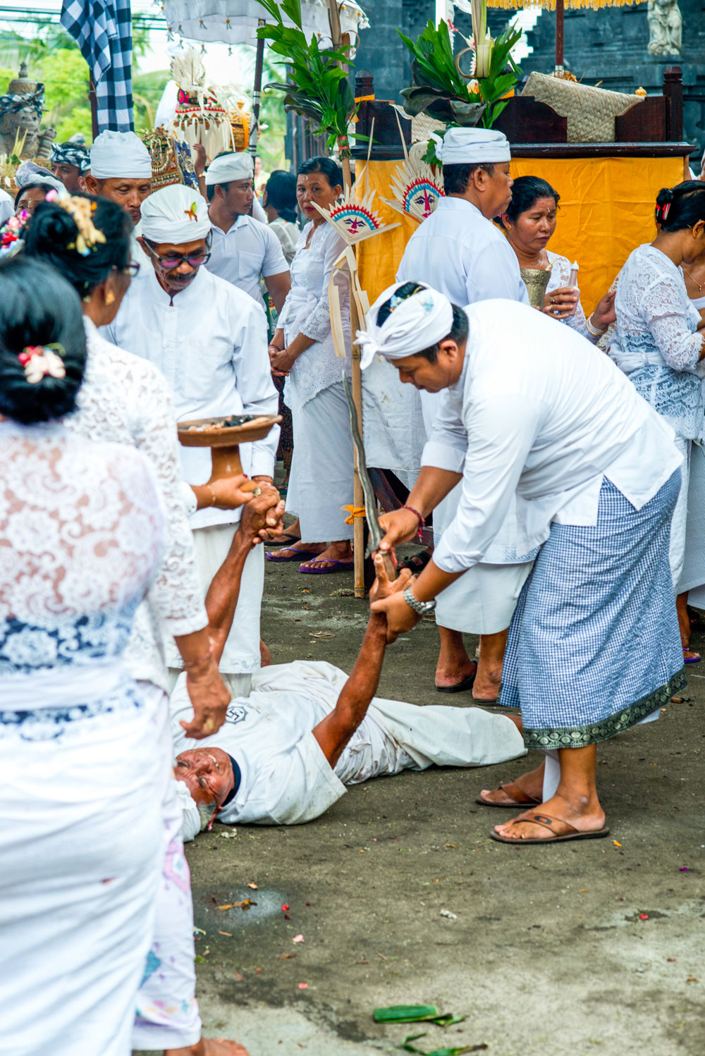 A long kris or dagger placed into the tranced-out devotee's hand...