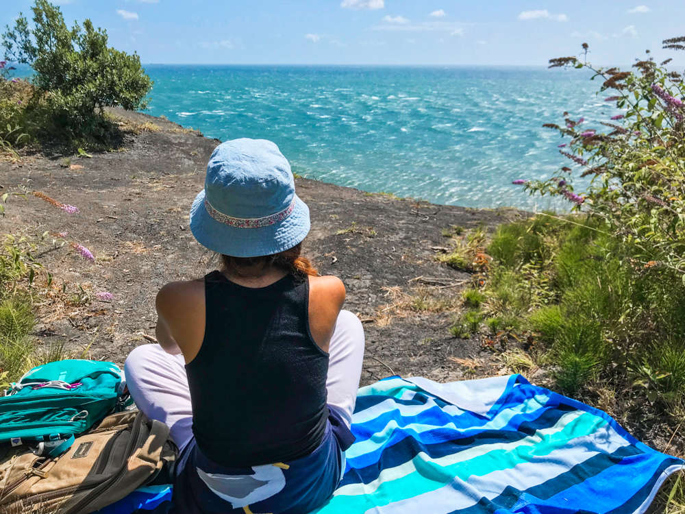 Meditating in front of the sea.